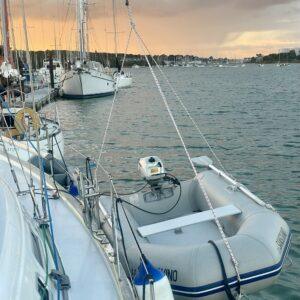 Dinghy hauled up on a halyard at the Folly