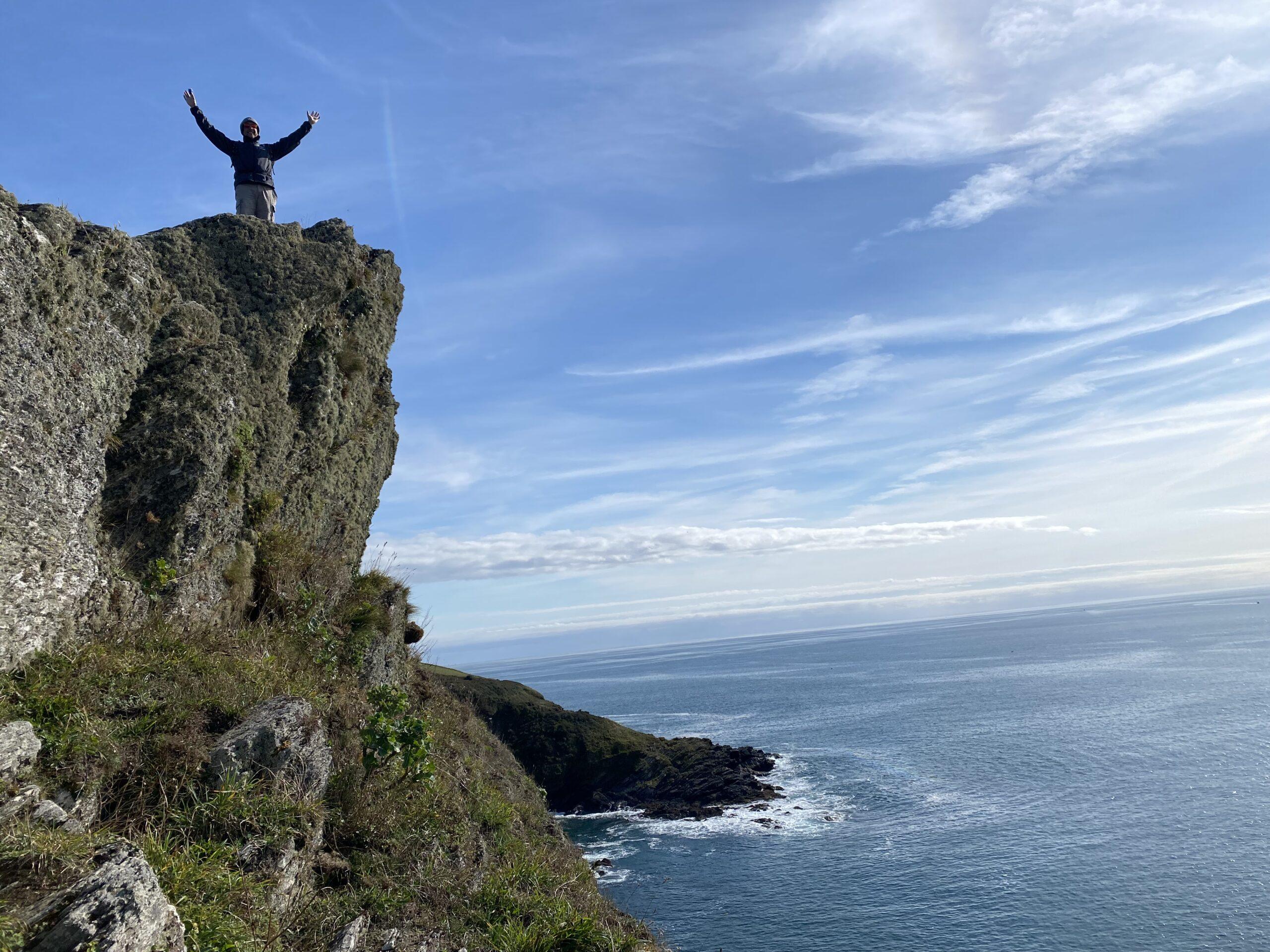 Chris exploring the rugged coastline