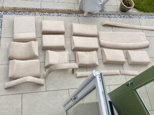 Attempting to clean the old upholstery on the patio