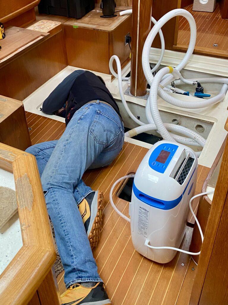 Chris amongst the pipes being replaced