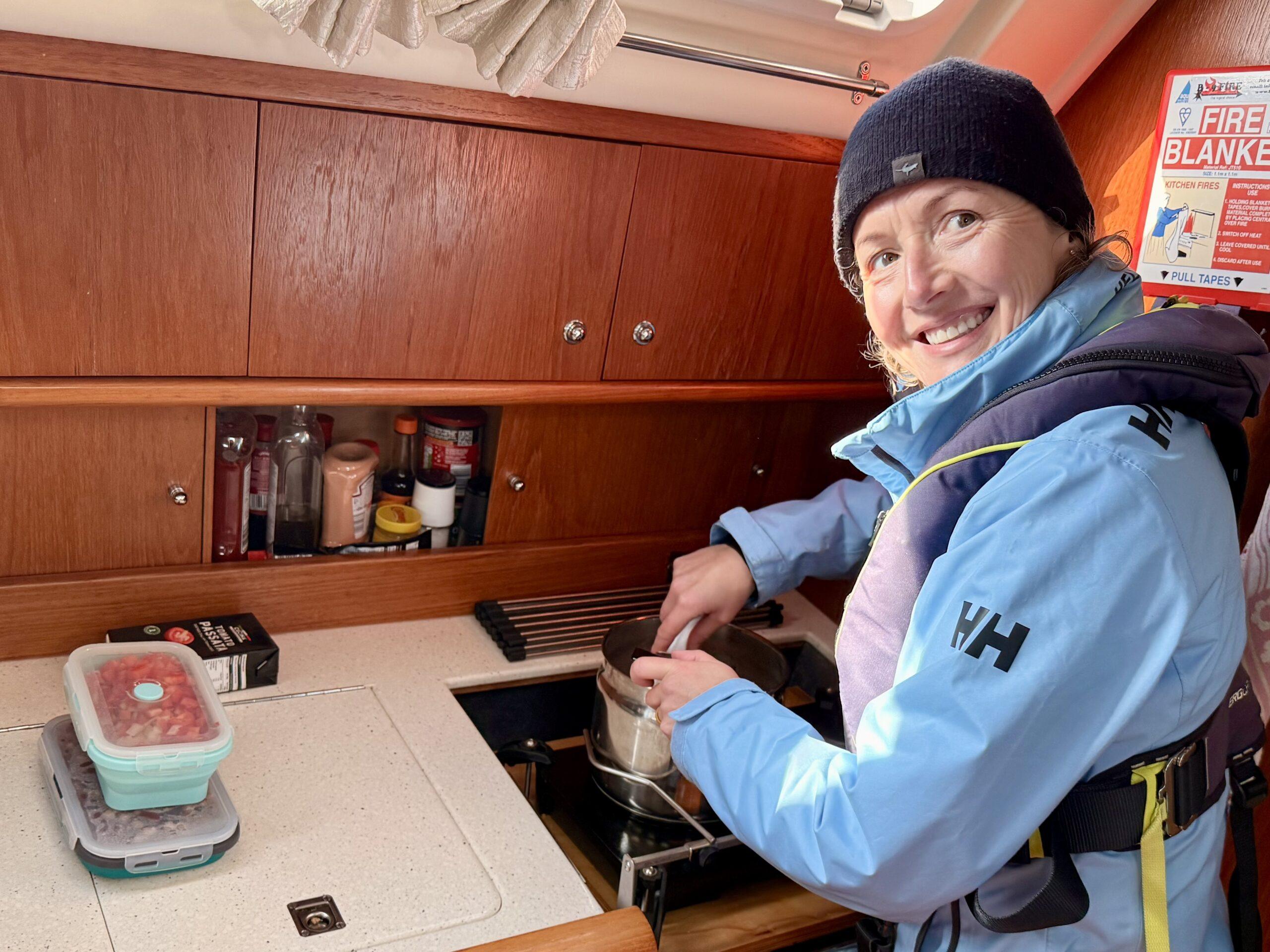 Jenni prepares dinner underway in the Mr D